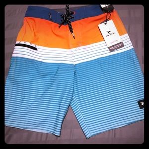 BNWT boys size 25 Rip Curl Mirage surf shorts.
